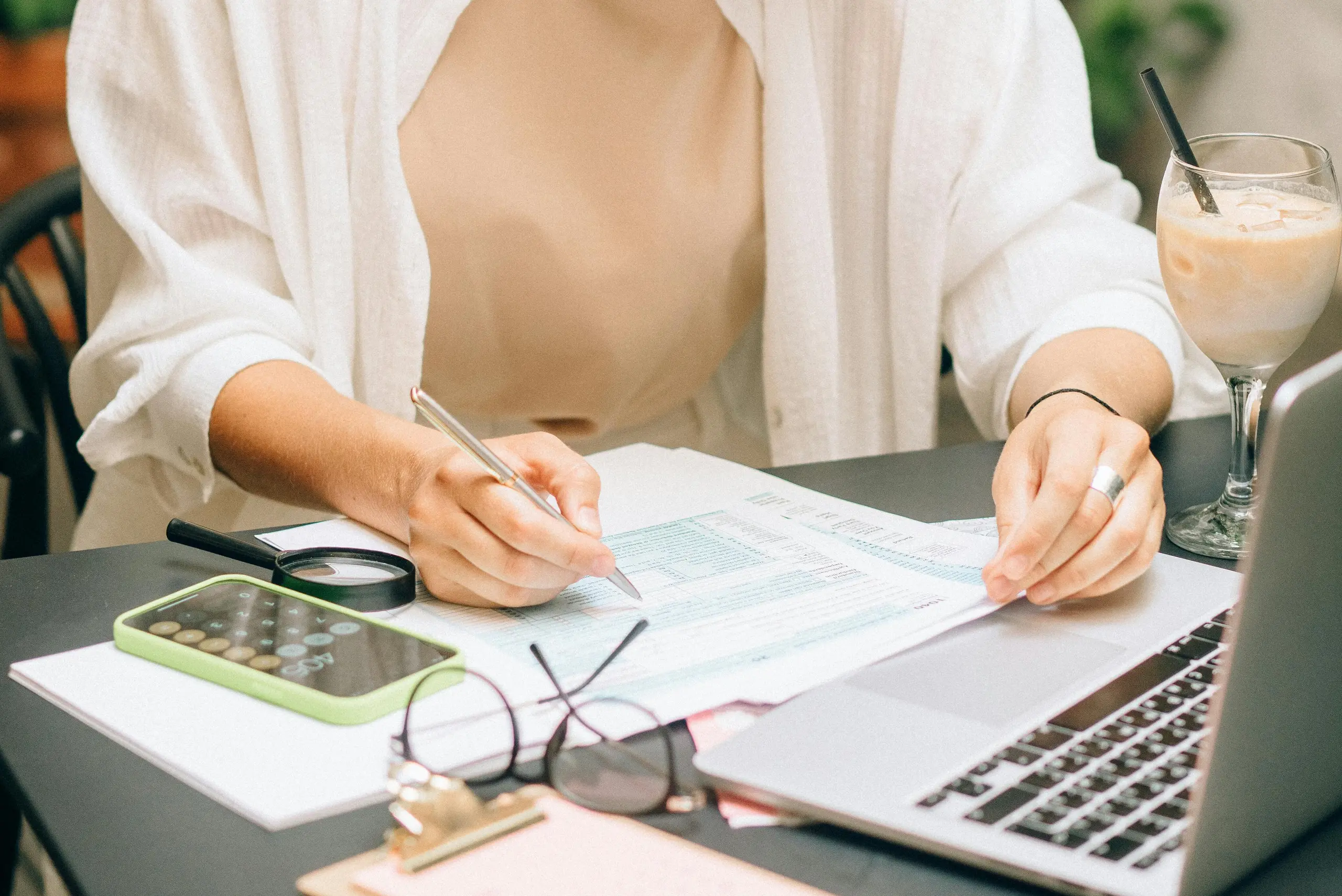 Dog groomer reviewing pricing strategy and market rates for UK grooming services in 2025